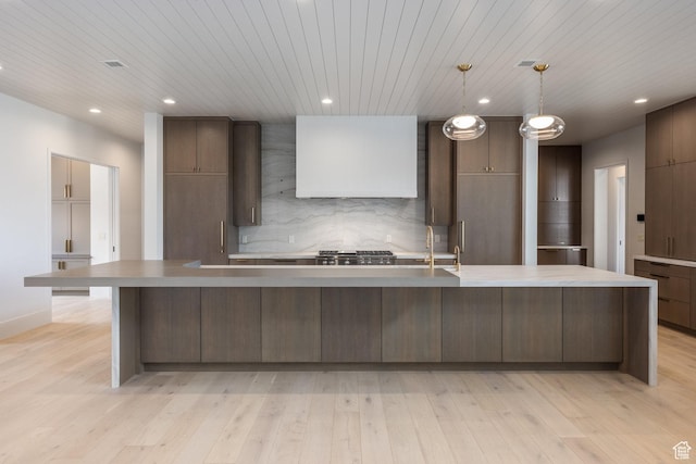 13926 S Jarvie Ln E, Draper, UT 84020 - kitchen featuring wall chimney exhaust hood, light wood-style flooring, decorative backsplash, and wood ceiling