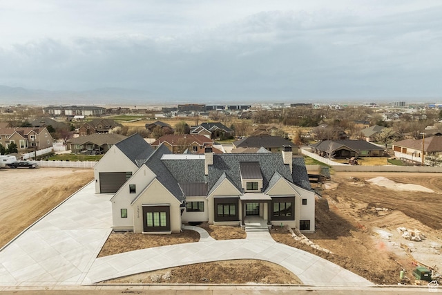 13926 S Jarvie Ln E, Draper, UT 84020 - view of front of property featuring stucco siding, a standing seam roof, metal roof, a residential view, and driveway
