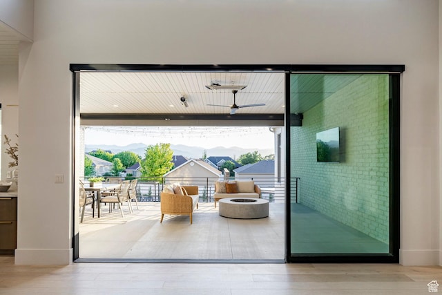 13926 S Jarvie Ln E, Draper, UT 84020 - doorway with wood finished floors, floor to ceiling windows, and baseboards