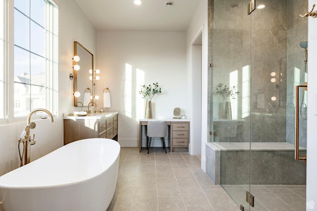 13926 S Jarvie Ln E, Draper, UT 84020 - full bath with vanity, a freestanding bath, a shower stall, tile patterned floors, and baseboards