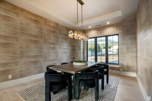 13926 S Jarvie Ln E, Draper, UT 84020 - dining room with light wood-style floors, a tray ceiling, a chandelier, and recessed lighting