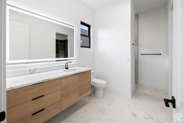 121 E Terrace Ln, Ivins, UT 84738 - bathroom featuring marble finish floor, baseboards, toilet, and vanity