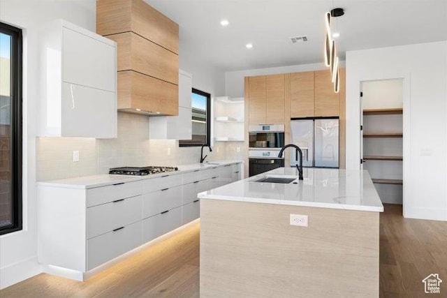 121 E Terrace Ln, Ivins, UT 84738 - kitchen with modern cabinets, open shelves, a sink, and white fridge with ice dispenser