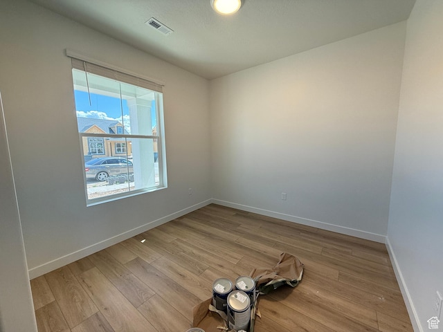 6 S 3830 W Unit 417, West Point, UT 84015 - unfurnished room with light wood-type flooring, visible vents, and baseboards