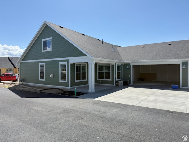 6 S 3830 W Unit 417, West Point, UT 84015 - view of front of house with a shingled roof, concrete driveway, and a garage