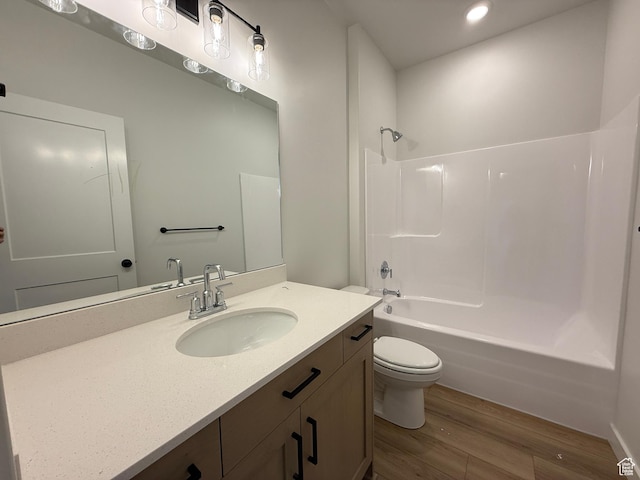 6 S 3830 W Unit 417, West Point, UT 84015 - bathroom featuring recessed lighting, wood finished floors, shower / bath combination, toilet, and vanity