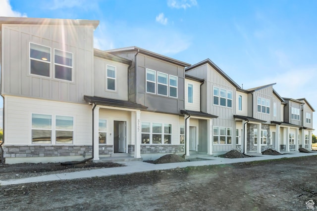 3175 S 208 W, Nibley, UT 84321 - townhome / multi-family property with stone siding and board and batten siding
