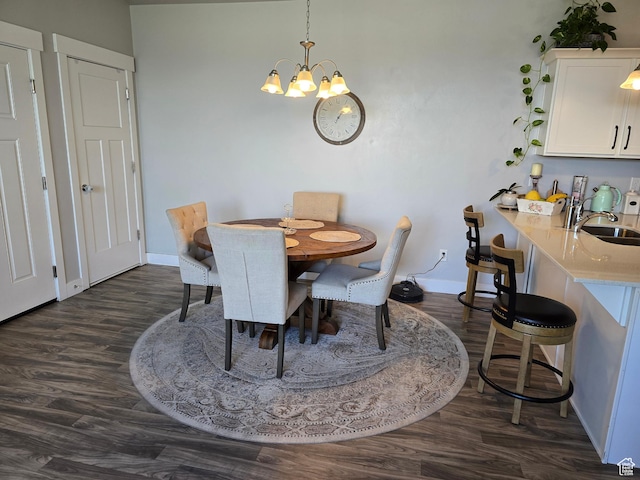 15 W Seasons Dr, Vineyard, UT 84059 - dining space with dark wood-type flooring, a chandelier, and baseboards