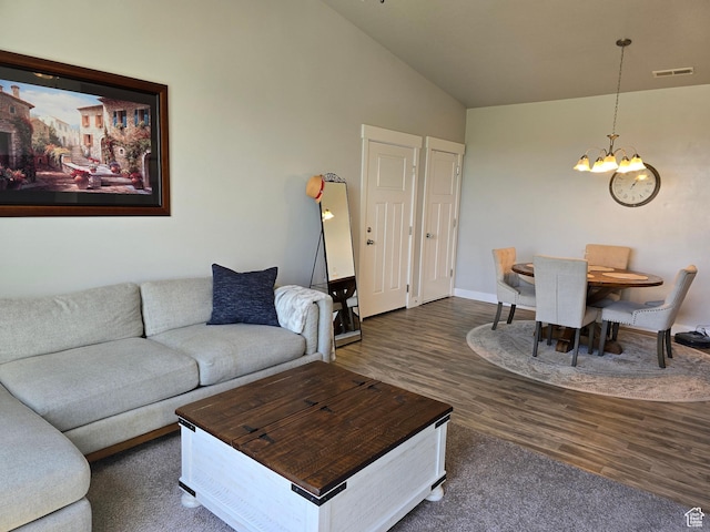 15 W Seasons Dr, Vineyard, UT 84059 - living room featuring a chandelier, lofted ceiling, wood finished floors, and baseboards