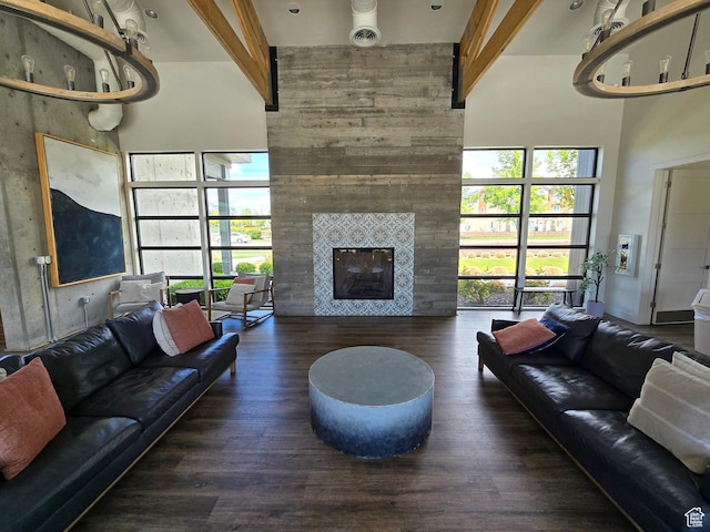 15 W Seasons Dr, Vineyard, UT 84059 - living area with a high ceiling, wood finished floors, and a tiled fireplace