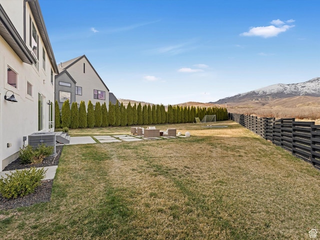 12224 N Bridgegate Way, Highland, UT 84003 - view of yard with a mountain view, central air condition unit, fence, and a patio area