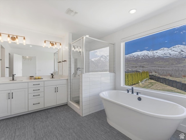 12224 N Bridgegate Way, Highland, UT 84003 - full bathroom featuring a freestanding tub, a sink, a stall shower, visible vents, and double vanity