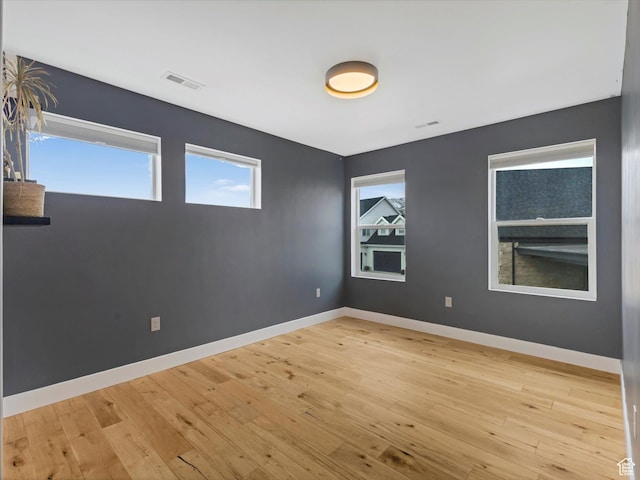 12224 N Bridgegate Way, Highland, UT 84003 - empty room with baseboards, visible vents, and light wood-style flooring