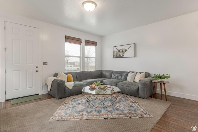 living room featuring baseboards and wood finished floors