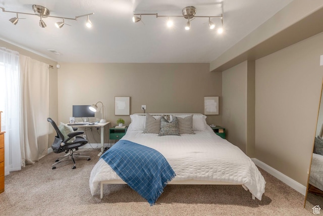 bedroom featuring carpet flooring and baseboards