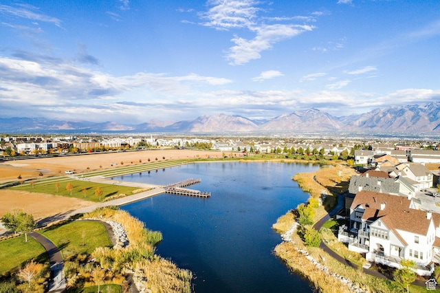 drone / aerial view featuring a water and mountain view