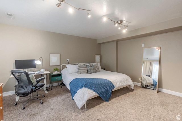 bedroom with baseboards and visible vents