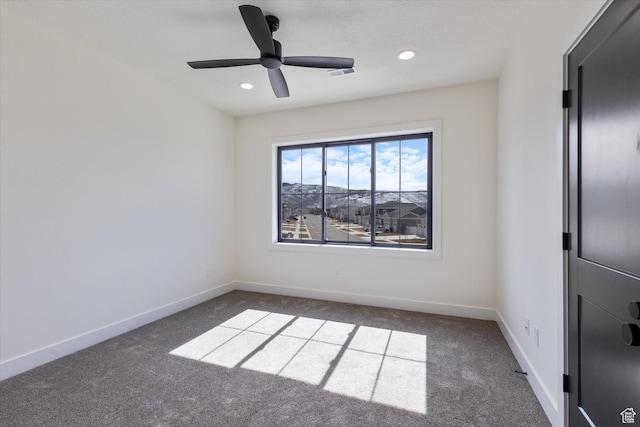 carpeted empty room featuring baseboards, visible vents, recessed lighting, and a ceiling fan