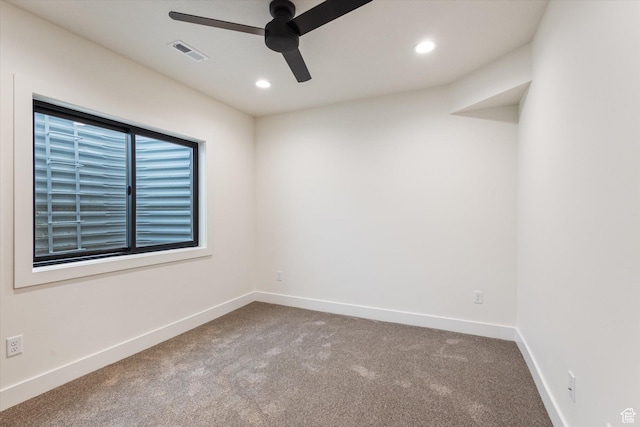 spare room featuring carpet floors, a ceiling fan, baseboards, visible vents, and recessed lighting