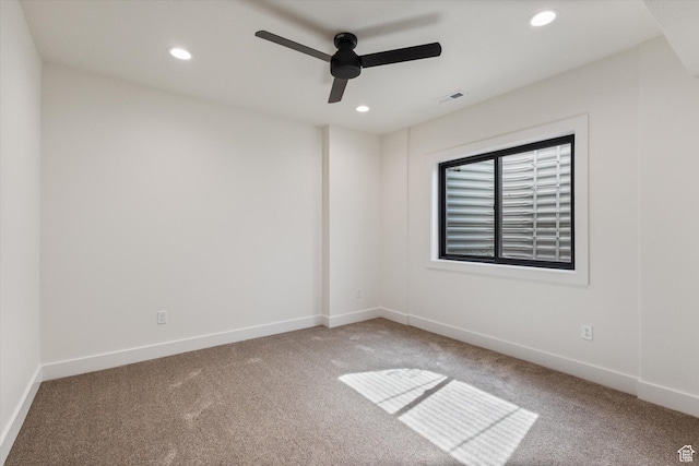 carpeted empty room with baseboards, ceiling fan, visible vents, and recessed lighting