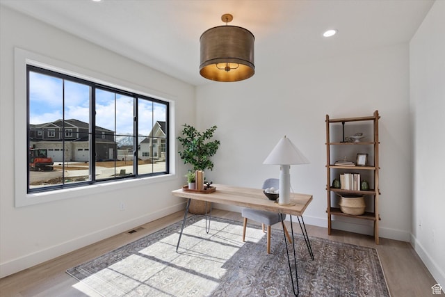 office with wood finished floors, recessed lighting, baseboards, and visible vents