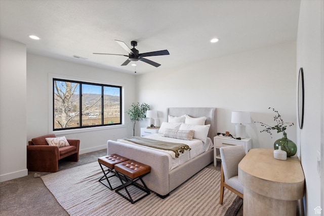 bedroom with light colored carpet, visible vents, recessed lighting, and baseboards