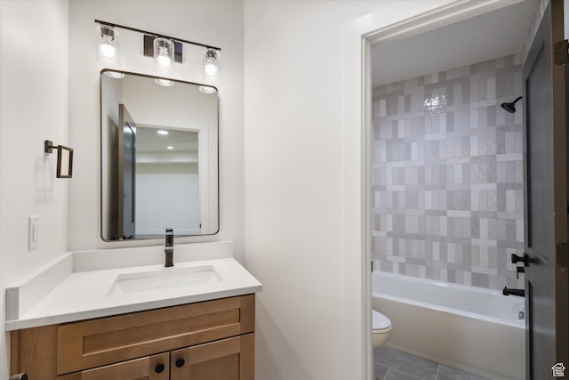 bathroom with toilet, tile patterned flooring, vanity, and shower / bathtub combination