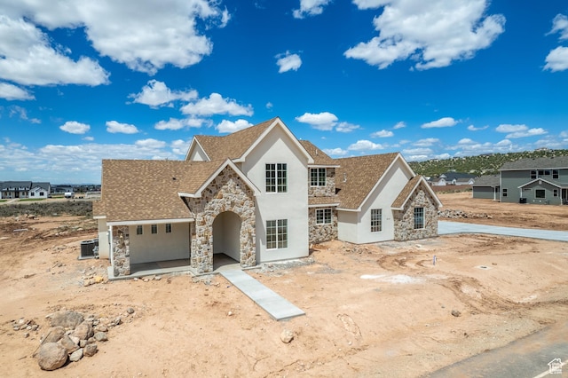 4416 W 1900 S, Cedar City, UT 84720 - view of front of house with stone siding, stucco siding, and roof with shingles