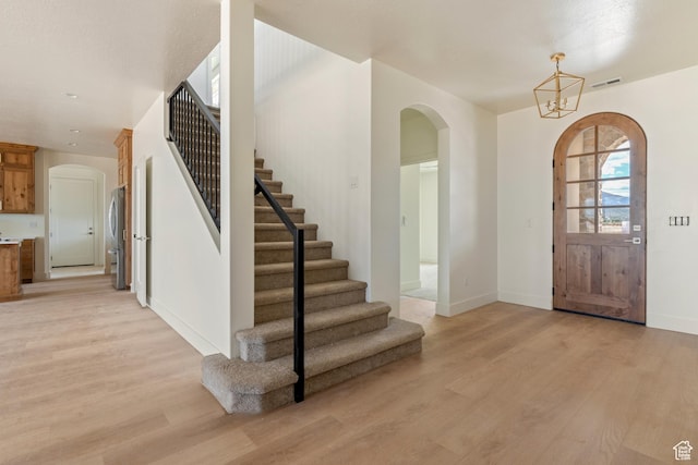 4416 W 1900 S, Cedar City, UT 84720 - foyer entrance with arched walkways, light wood finished floors, and stairway