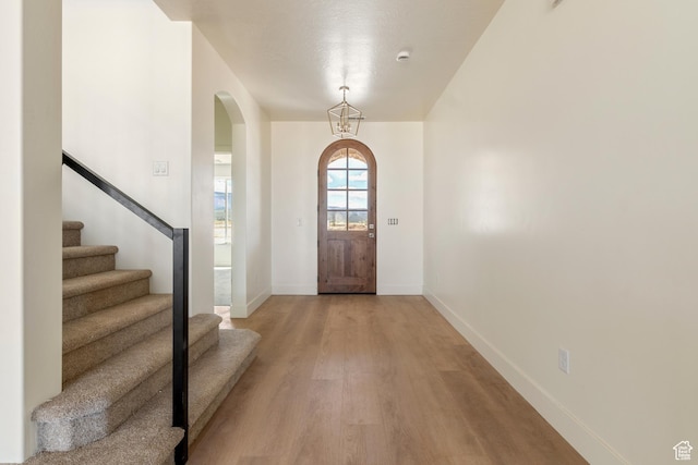 4416 W 1900 S, Cedar City, UT 84720 - foyer featuring arched walkways, light wood-style flooring, baseboards, and stairway
