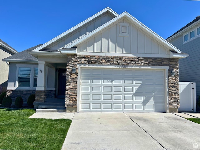 13207 S Weatherford Ln W, Herriman, UT 84096 - craftsman house featuring stone siding, board and batten siding, a garage, and concrete driveway