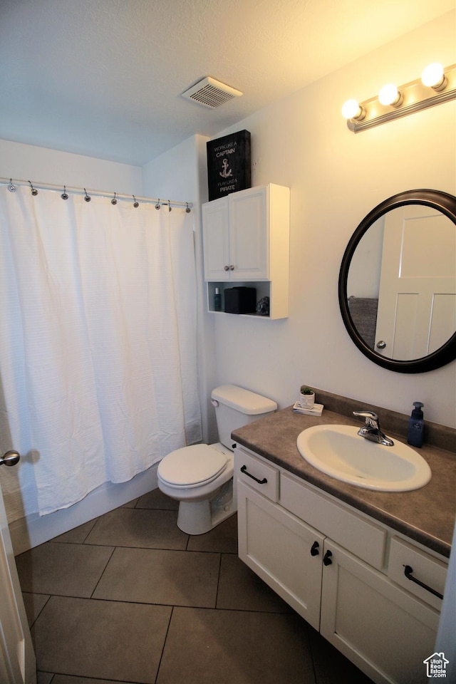 13207 S Weatherford Ln W, Herriman, UT 84096 - full bathroom featuring tile patterned flooring, vanity, toilet, visible vents, and shower / bath combo with shower curtain