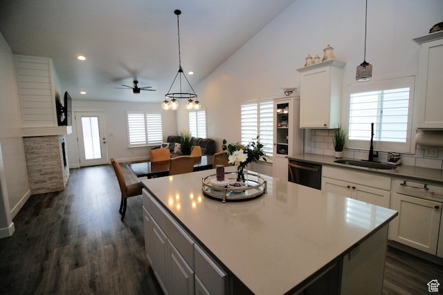 13207 S Weatherford Ln W, Herriman, UT 84096 - kitchen featuring dishwasher, a ceiling fan, dark wood finished floors, a sink, and backsplash