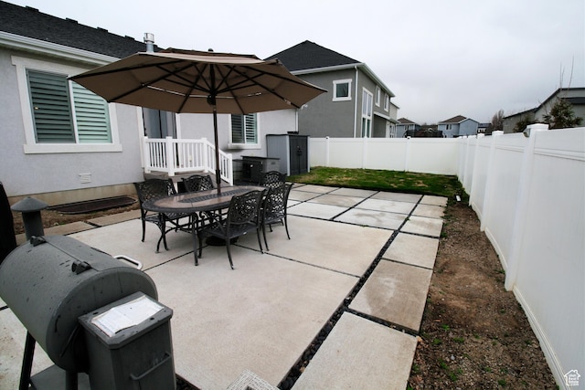 13207 S Weatherford Ln W, Herriman, UT 84096 - view of patio featuring a fenced backyard and outdoor dining space