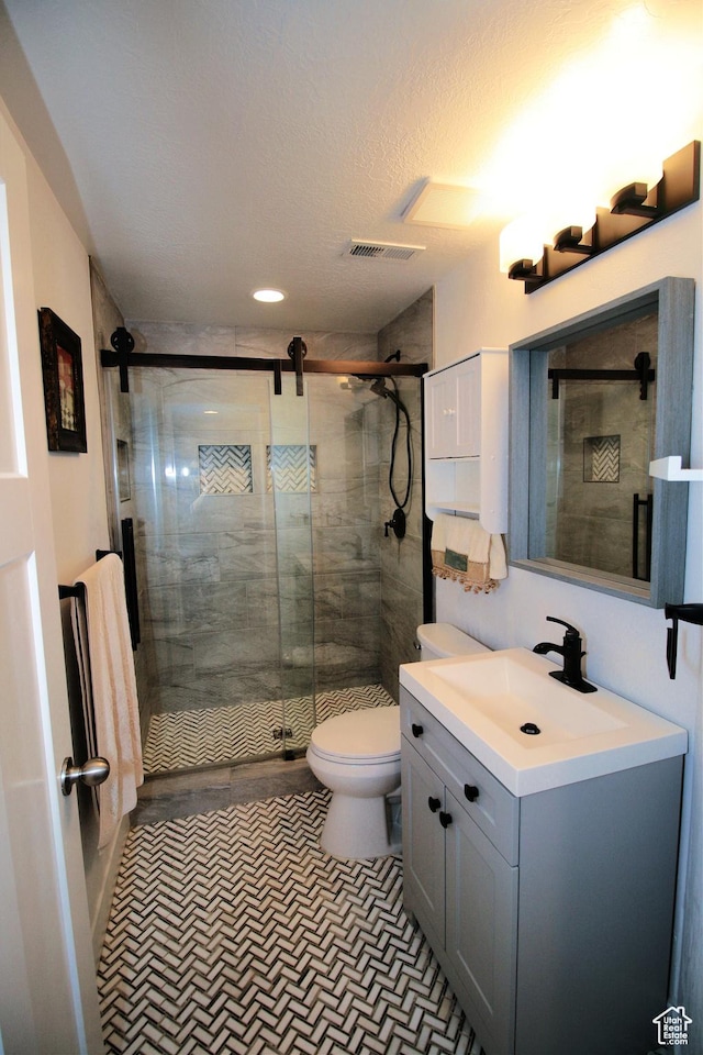 13207 S Weatherford Ln W, Herriman, UT 84096 - full bathroom with a stall shower, visible vents, toilet, and vanity