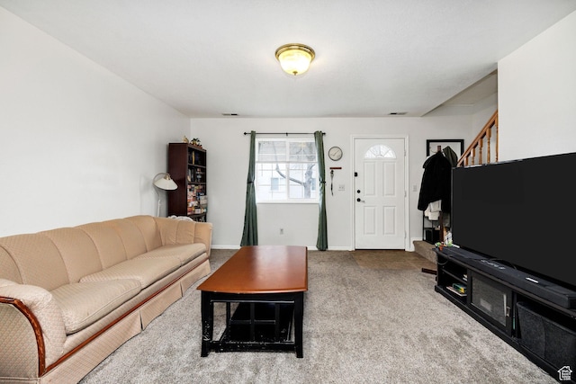 105 W Penhurst Pl N, Logan, UT 84341 - living area featuring baseboards, visible vents, and carpet
