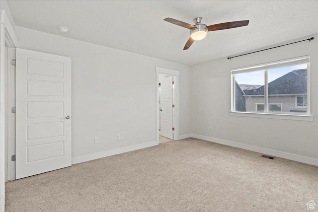 13192 S Lowick Ln, Herriman, UT 84096 - spare room with a textured ceiling, visible vents, baseboards, ceiling fan, and light colored carpet