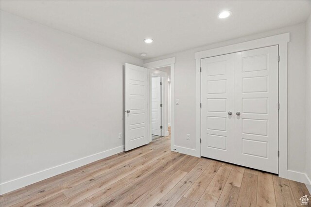 13192 S Lowick Ln, Herriman, UT 84096 - unfurnished bedroom featuring baseboards, a closet, light wood-style flooring, and recessed lighting