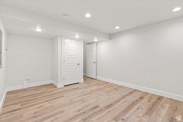 13192 S Lowick Ln, Herriman, UT 84096 - finished basement featuring light wood-style flooring and baseboards