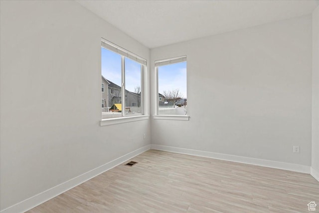 13192 S Lowick Ln, Herriman, UT 84096 - empty room with light wood-style floors, baseboards, and visible vents