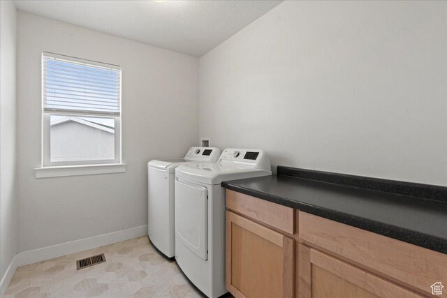 13192 S Lowick Ln, Herriman, UT 84096 - laundry area with baseboards, washing machine and dryer, and visible vents