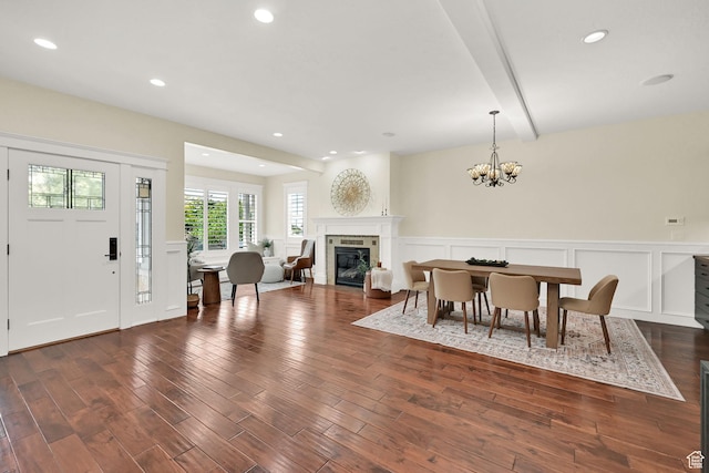 3059 S Lola Cir, Millcreek, UT 84109 - dining area featuring a wainscoted wall, an inviting chandelier, a decorative wall, and dark wood-style flooring