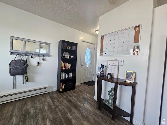 345 E 800 N, Duchesne, UT 84021 - entrance foyer featuring a baseboard radiator, dark wood-type flooring, baseboards, and a textured ceiling