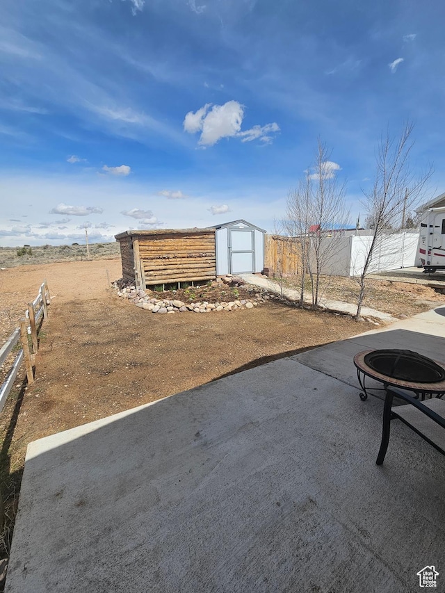 345 E 800 N, Duchesne, UT 84021 - view of yard featuring an outdoor fire pit, a shed, an outdoor structure, and fence