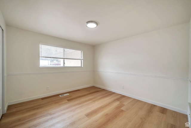 4195 W Kirkcaldy Cir S, South Jordan, UT 84009 - spare room featuring visible vents, baseboards, and light wood-style flooring