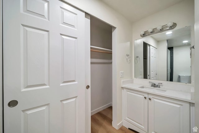 4195 W Kirkcaldy Cir S, South Jordan, UT 84009 - bathroom featuring vanity, baseboards, and wood finished floors