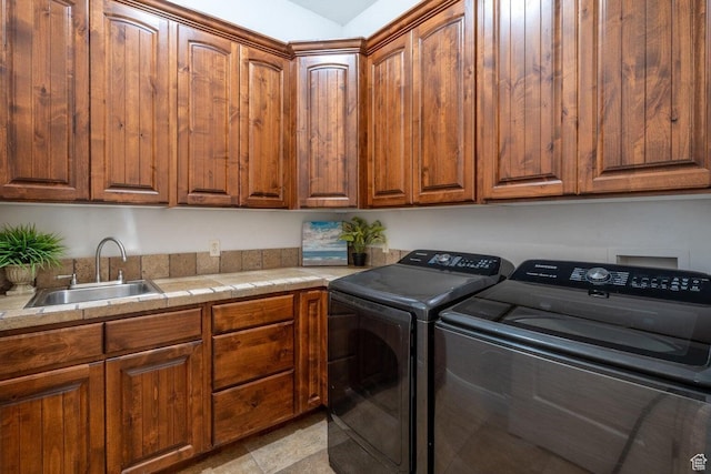 2104 S Corral Way, Washington, UT 84780 - laundry room with separate washer and dryer, cabinet space, and a sink