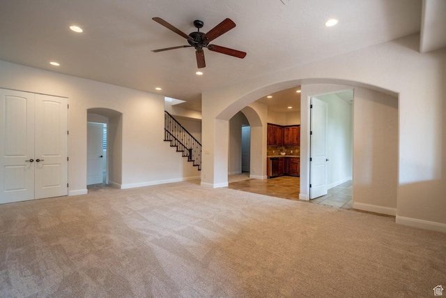 2104 S Corral Way, Washington, UT 84780 - unfurnished living room with a ceiling fan, light carpet, baseboards, and recessed lighting