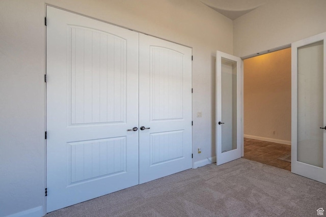 2104 S Corral Way, Washington, UT 84780 - unfurnished bedroom featuring a closet, carpet floors, and french doors