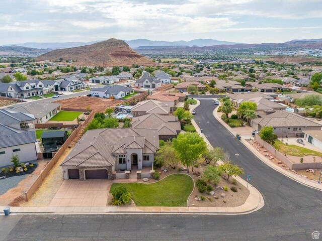drone / aerial view with a residential view and a mountain view